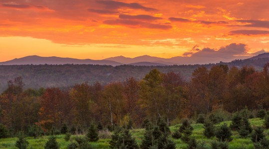 Sunrise over the White Mountains as seen from The Rocks Estate in Bethlehem, New Hampshire.