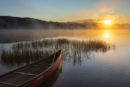 Canoe at sunrise in the Maine Woods.